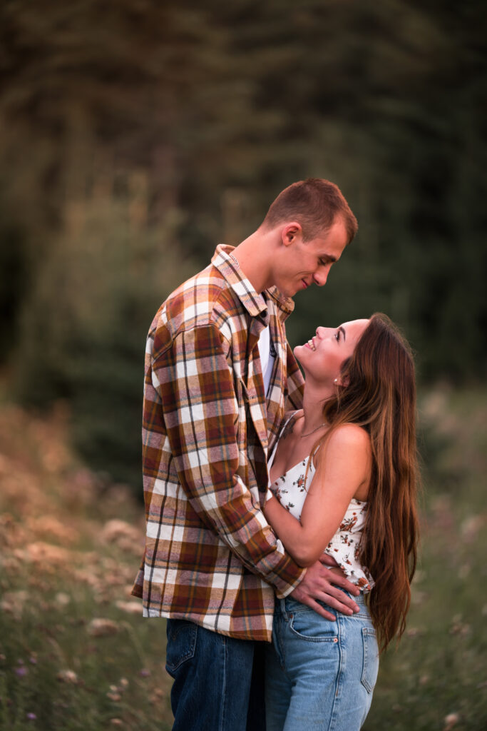 Edmonton engagement photography session with couple looking at each other in love